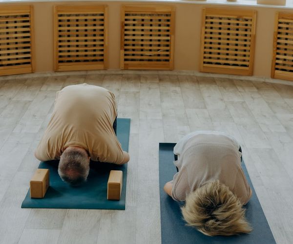 Man in a state of deep concentration during a flexibility exercise.
