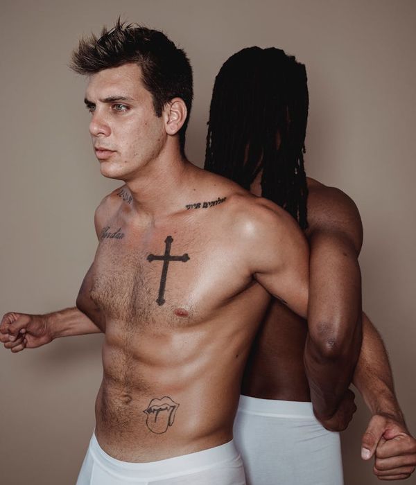 Man performing a powerful core strength exercise in a minimalist gym.